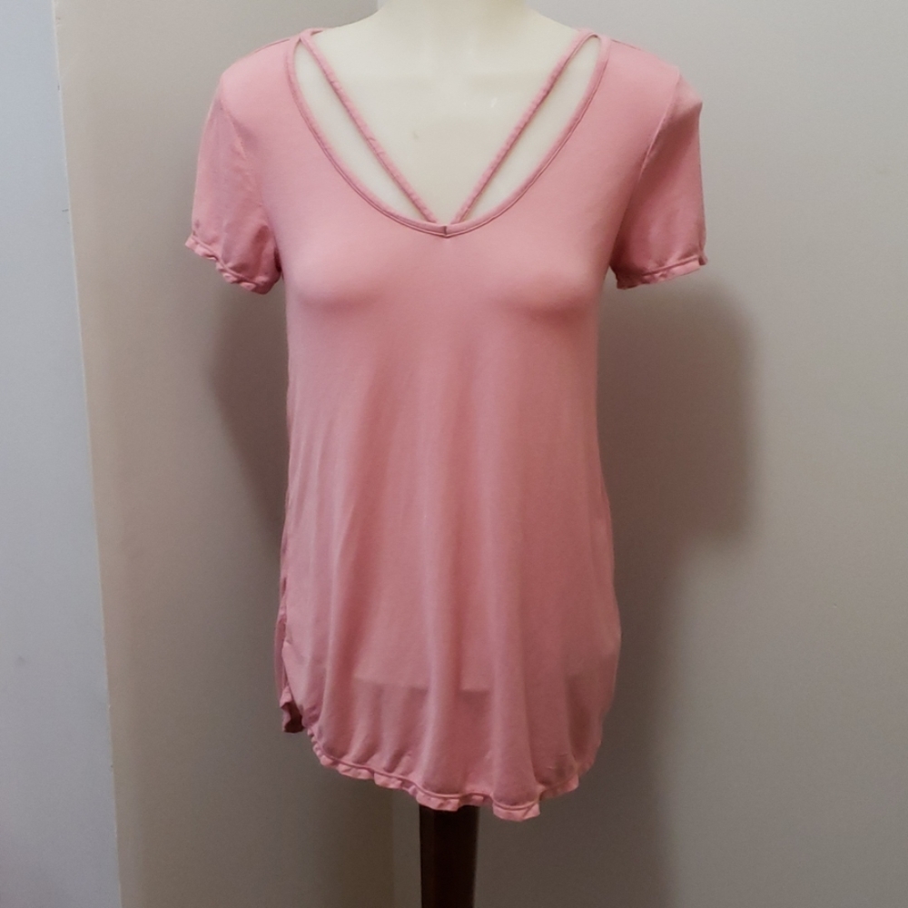 Salmon/pink colored short sleeve top.